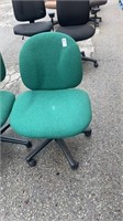 2 green office chairs on rollers