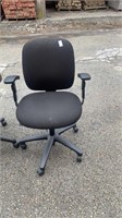 2 black office chairs 2 different sizes