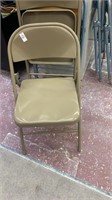 2 brown folding chairs , 2 blue folding chairs