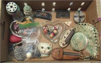 Assortment of trinket items including chalkware