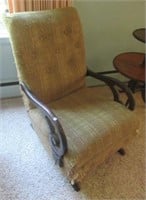 Vintage rocking chair with upholstery.