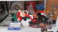 Contents of shelf including Christmas décor,