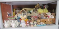 Contents of shelf including stuffed rabbits,