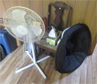 Collection of household items including fan,