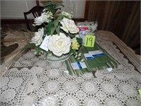 Table cloth, napkins, floral arrangement, place ma