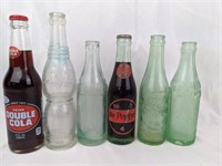 Six Vintage Soda Bottles