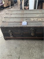 Antique trunk with baby clothes in it