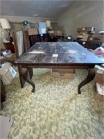 Antique dining table with several leaves