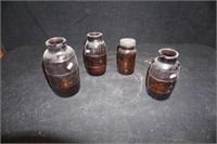Collection of Four Brown Bottles