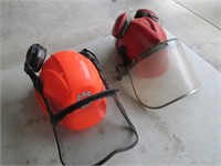 two hardhats, with faceshields