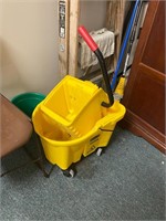 yellow Rubbermaid mop bucket wheels commercial use
