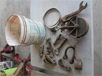wooden pulley, antique iron in bucket