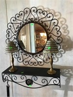 Brass candle holders, metal wall decor and shelf