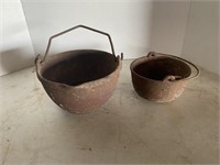 Two (2) small cast smelting pots