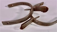 Pr. Iron spurs, 2.25" wide opening, 3.5" long.