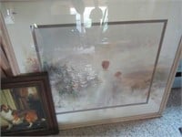 Framed art showing mother and child.