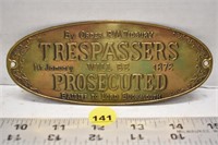 Brass "Trespassers will be prosecuted" sign -