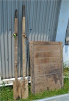 Hand made oars and  wooden barn door/window