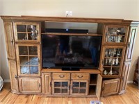 Wood entertainment center with curios