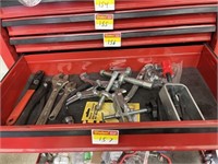 Drawer of pullers and adjustable wrenches