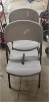 2 plastic back and seat foldable chairs 1 has a