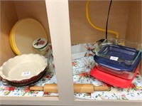 Misc. baking dishes in cabinet.