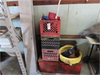 Milk cans, car oil, funnel, and large red toolbox