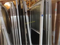 Large assortment of screen doors, 32 by 78, 32 by