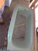 Vintage light green steel bathtub