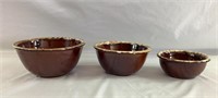 Three brown drip nesting bowls