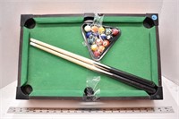 Miniature pool table with cues and balls