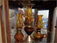 3 amber colored Kerosene lamps