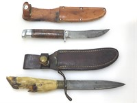 Pair of knives with leather sheath, approx 10