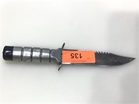 Survival knife with storage on handle, approx