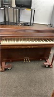 Wurlitzer piano with E-Z piano glider