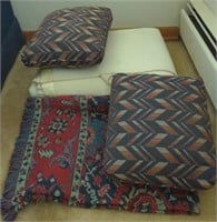 (B) Lot of throw pillows and blankets