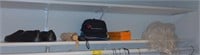 (B) Contents of shelf w/ umbrella and hats