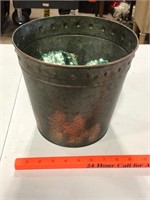 Metal bucket with tree design and ornaments