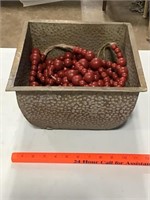 Metal container and stringed wood beads / garland