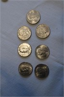 7 Ike & 3 Sacagawea Dollars