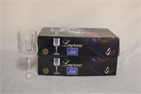 New in box, two sets of 4 Longchamps 24% lead,