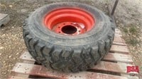 1 - 12-16.5 NHS Skid-Steer tire on rim
