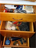 Contents of 3 drawers- batteries, gloves, etc.