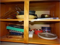 Contents of cabinet above frig.- trays, baking