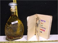 OIL BOTTLE AND STAMP BOOK