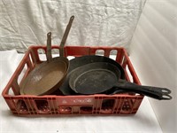 (4) vintage frying pans in Coca Cola crate