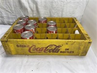 Coca Cola crate containing (9) unopened cans
