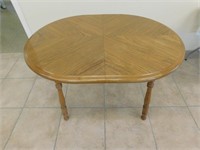Oval Dining Table with Ornately Design Top
