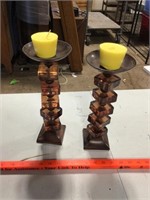 Pair of glass candle pillars with yellow candles