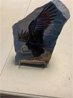 Eagle painted on rock with stand